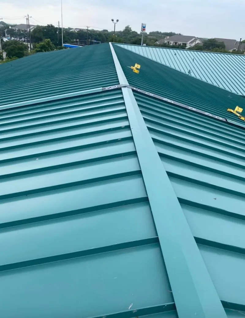 Green commercial metal roof ridge and valley for Metal Roof Repair in Harrison